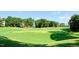 Expansive view of the meticulously manicured golf course, offering lush greenery and gentle slopes at 4912 Sunset Forest Cir, Holly Springs, NC 27540