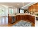 Gourmet kitchen featuring stainless steel appliances, custom cabinets, and quartz countertops at 4912 Sunset Forest Cir, Holly Springs, NC 27540