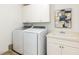 Laundry room with sink, modern appliances, and storage for convenience at 4912 Sunset Forest Cir, Holly Springs, NC 27540