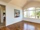 Bright living area with vaulted ceiling, hardwood floors, large windows, and stylish decor at 4912 Sunset Forest Cir, Holly Springs, NC 27540