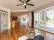 Open-concept living space with hardwood floors, access to the deck, and a seamless flow to the kitchen at 4912 Sunset Forest Cir, Holly Springs, NC 27540