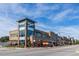 Daytime view of retail shops and dining options in the walkable town center at 4912 Sunset Forest Cir, Holly Springs, NC 27540