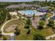 Aerial view of community amenities including a pool, clubhouse, playground, and recreational areas at 518 Oak Forest View Ln, Wake Forest, NC 27587