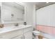 Bright bathroom featuring a sleek vanity with a white countertop and modern fixtures at 518 Oak Forest View Ln, Wake Forest, NC 27587
