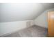 Attic storage space with carpet and angled ceilings, offering an opportunity for organized living at 518 Ranch Farm Rd, Raleigh, NC 27603