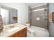 Bathroom features a vanity with granite countertops, and a tiled shower-over-tub at 518 Ranch Farm Rd, Raleigh, NC 27603