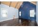 Bedroom with vaulted ceiling, exposed wood beams, and hardwood flooring at 518 Ranch Farm Rd, Raleigh, NC 27603
