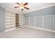 Bedroom with neutral carpet, painted walls and a built in bookshelf to another room at 518 Ranch Farm Rd, Raleigh, NC 27603