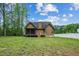 Exterior of house with large yard, screened porch, and an exterior staircase at 518 Ranch Farm Rd, Raleigh, NC 27603