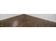 Dark hardwood flooring with white molding along the perimeter of the room at 518 Ranch Farm Rd, Raleigh, NC 27603