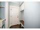 Mudroom featuring built-in bench, storage, and direct access to exterior at 518 Ranch Farm Rd, Raleigh, NC 27603