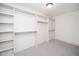 Well-organized walk-in closet with built-in shelving and ample storage space, ready for clothes at 518 Ranch Farm Rd, Raleigh, NC 27603