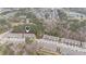 Community aerial view featuring townhomes surrounded by green spaces and mature trees at 521 Rockcastle Dr, Cary, NC 27519