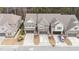 Aerial view of townhomes with attached garages and well-maintained driveways in a residential area at 521 Rockcastle Dr, Cary, NC 27519