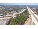 Aerial view of community near highways and recreational area with swimming pool and lake at 521 Rockcastle Dr, Cary, NC 27519