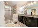 Bathroom features a glass enclosed shower, a double vanity and tile flooring at 521 Rockcastle Dr, Cary, NC 27519