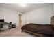 Bedroom features a comfy bed, a desk, neutral carpet, and access to other rooms at 521 Rockcastle Dr, Cary, NC 27519