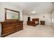 Large bedroom features carpet floors, neutral walls, natural light, and dark furniture at 521 Rockcastle Dr, Cary, NC 27519