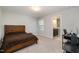 Bedroom features a bed, a desk, neutral carpet and access to a bathroom at 521 Rockcastle Dr, Cary, NC 27519