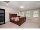 Bedroom featuring carpet floors, neutral walls, natural light, and a large bed at 521 Rockcastle Dr, Cary, NC 27519