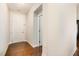 Bright foyer with hardwood floors, a white front door, and access to other rooms in the home at 521 Rockcastle Dr, Cary, NC 27519