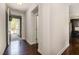 Bright entryway with hardwood flooring, leading to kitchen and living areas at 521 Rockcastle Dr, Cary, NC 27519