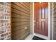 Close-up of the home's rich brown front door and complementary exterior finishes at 521 Rockcastle Dr, Cary, NC 27519