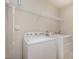 Bright laundry room with a Whirlpool washing machine and dryer at 521 Rockcastle Dr, Cary, NC 27519