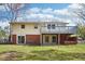 The exterior of the home features a deck and a sliding glass door to the basement at 5218 Revere Rd, Durham, NC 27713