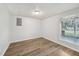 The updated basement room features modern vinyl floors and a large window at 5218 Revere Rd, Durham, NC 27713