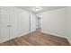 Basement bedroom featuring vinyl floors and access to other rooms at 5218 Revere Rd, Durham, NC 27713