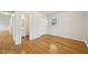 Bedroom featuring hardwood floors with attached bathroom at 5218 Revere Rd, Durham, NC 27713