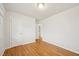 This spacious bedroom has hardwood floors and is freshly painted with white trim at 5218 Revere Rd, Durham, NC 27713