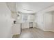 Efficient kitchen features clean white cabinetry and stainless steel dishwasher at 5218 Revere Rd, Durham, NC 27713