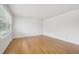 Spacious room with newly refinished hardwood floors and ample natural light at 5218 Revere Rd, Durham, NC 27713