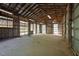 Barn interior showcasing exposed beams and a dirt floor at 5401 Friends School Rd, Durham, NC 27705