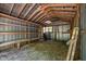 Barn interior showcasing shelving on metal walls and a dirt floor at 5401 Friends School Rd, Durham, NC 27705