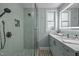 Modern bathroom with stylish tiles, glass enclosed shower, and sleek vanity with under cabinet storage at 5401 Friends School Rd, Durham, NC 27705