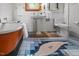 Bathroom features a clawfoot tub, pedestal sink, and white tiled walls and patterned floor at 5401 Friends School Rd, Durham, NC 27705