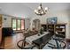 Inviting dining room with wood floors, gas fireplace, and natural light at 5401 Friends School Rd, Durham, NC 27705