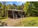 Rustic exterior with wood siding, dual entrances, and natural surroundings at 5401 Friends School Rd, Durham, NC 27705