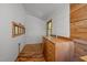 Hallway featuring custom wood cabinets, sink, and a window offering natural light at 5401 Friends School Rd, Durham, NC 27705