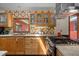 Charming kitchen featuring tile backsplash, stainless hood, and window overlooking exterior at 5401 Friends School Rd, Durham, NC 27705