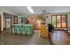 Bright, open kitchen with island seating, stainless steel appliances, and ample counter space at 5401 Friends School Rd, Durham, NC 27705