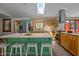 Modern kitchen boasts an island with seating and stainless steel appliances at 5401 Friends School Rd, Durham, NC 27705