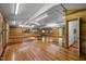 Bright living room with skylights, wood paneled walls, and gleaming hardwood floors at 5401 Friends School Rd, Durham, NC 27705