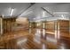Spacious living area showcasing wooden floors, paneled walls, and natural lighting at 5401 Friends School Rd, Durham, NC 27705