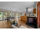 Open living space with wood floors, kitchen, dining room, and views of the outdoors at 5401 Friends School Rd, Durham, NC 27705
