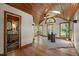 Inspiring home office with lots of natural light, hardwood floors, wood-beam ceiling, and a vaulted ceiling at 5401 Friends School Rd, Durham, NC 27705