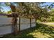 Landscaped yard featuring a custom metal and wood fence with rock sculpture detail at 5401 Friends School Rd, Durham, NC 27705
